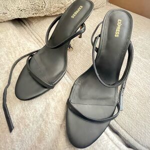 Express black heels with long laces on legs